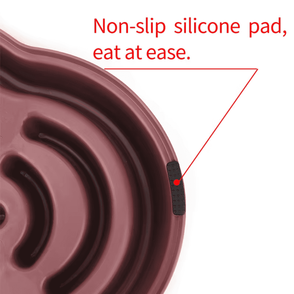 Close-up of purple non-slip slow feeder dog bowl showing silicone pad for stability and spill prevention during feeding.