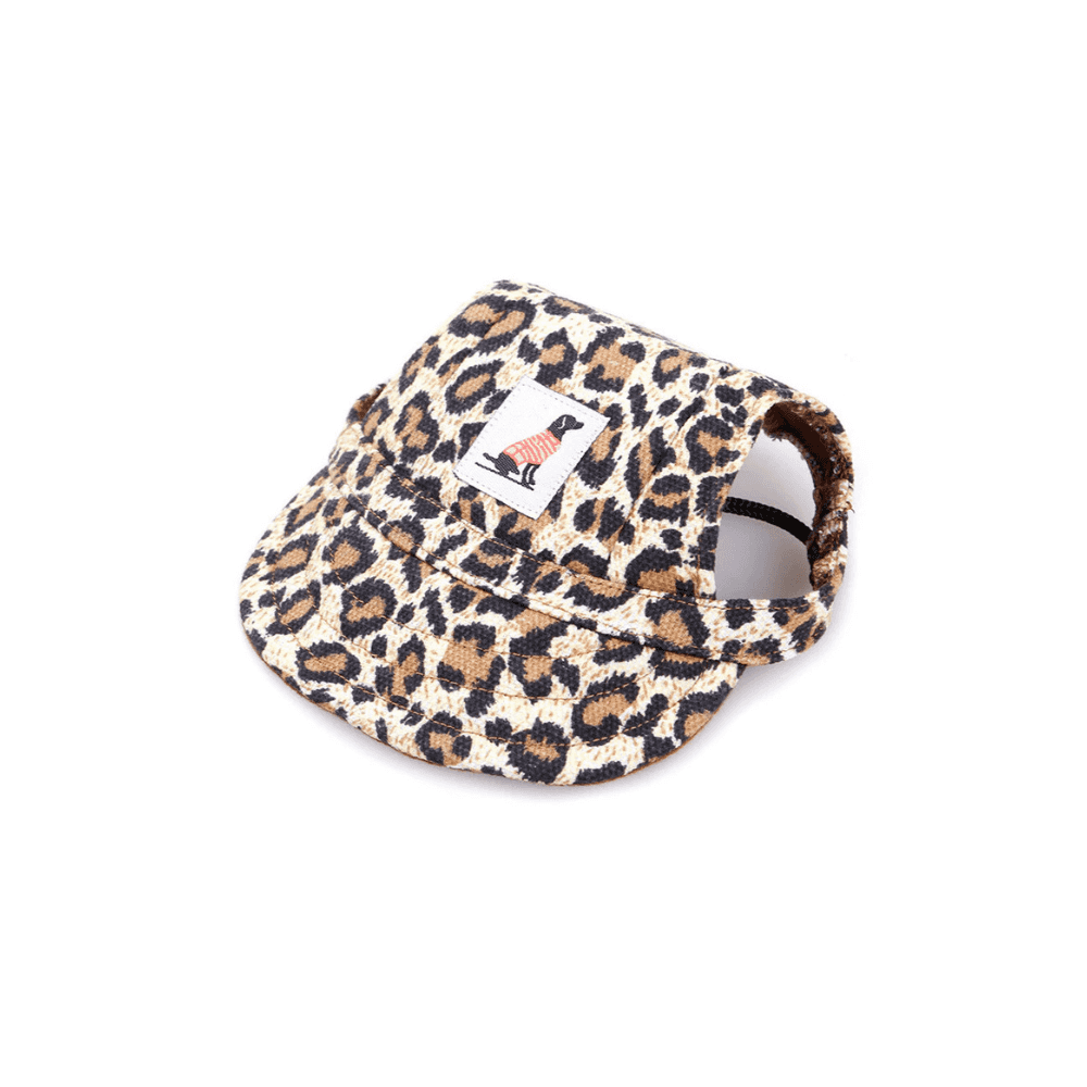 Leopard print Dog Sun cap with ear holes and adjustable strap, fashionable pet apparel for sun protection.