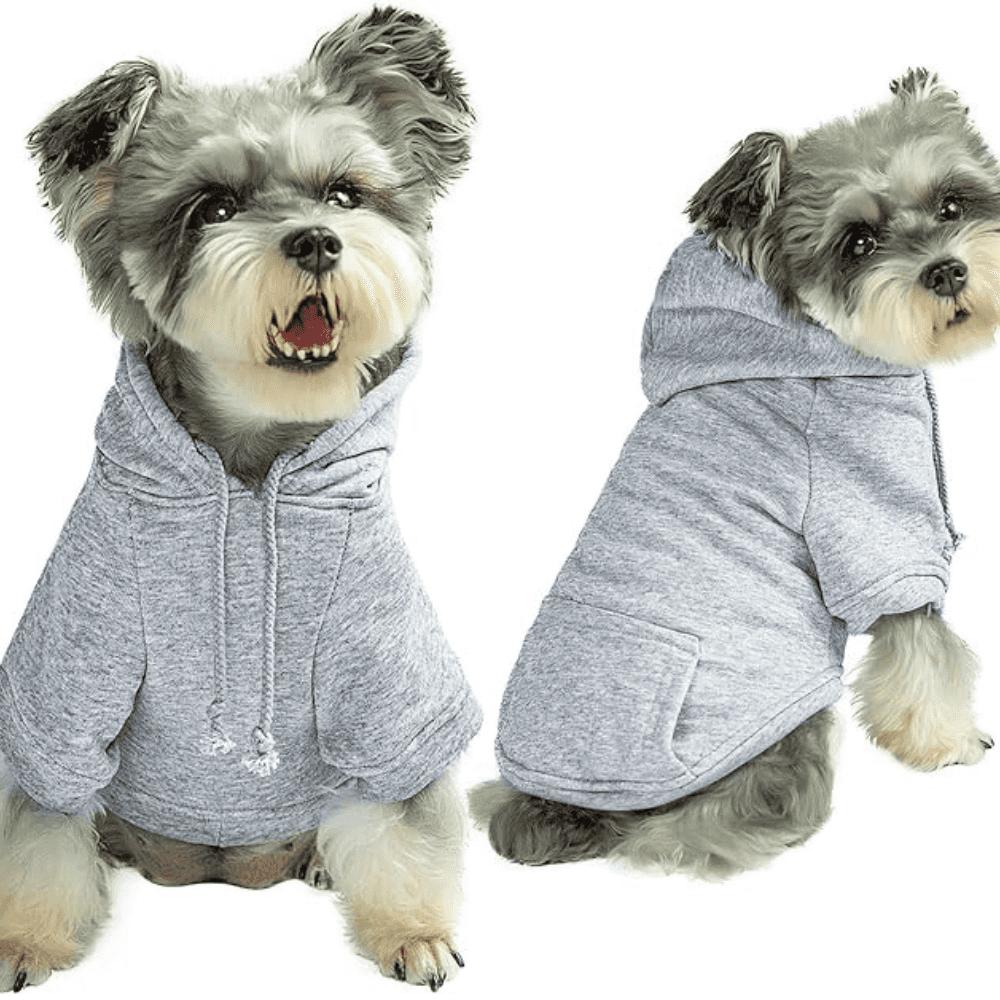 Gray dog hoodie with leash hole modeled by a small dog, made of soft fleece with a V-cut for comfort and machine washable fabric.