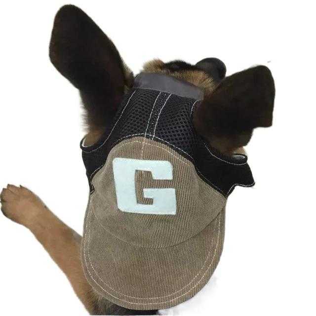 Back view of a dog wearing a brown version of the Denim Dog Cap - Durable Dog Hat for All Seasons with a bold 'G' patch.