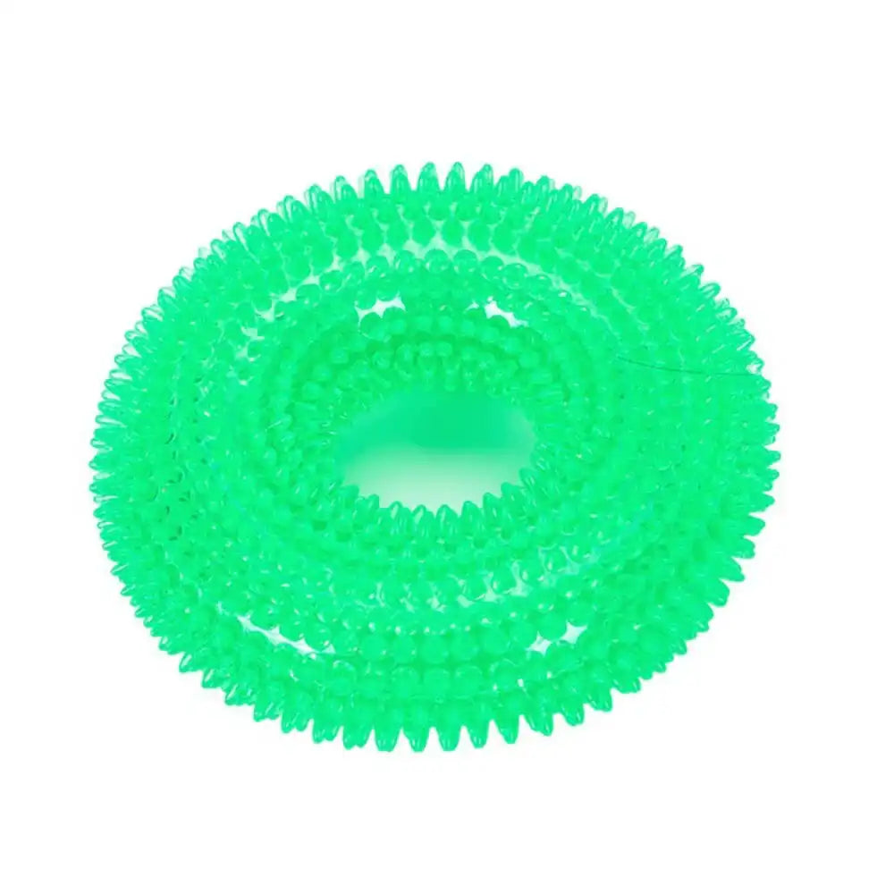 Green spiked TPR dog chew toy for interactive play, promoting healthy teeth and gums in dogs of all sizes.