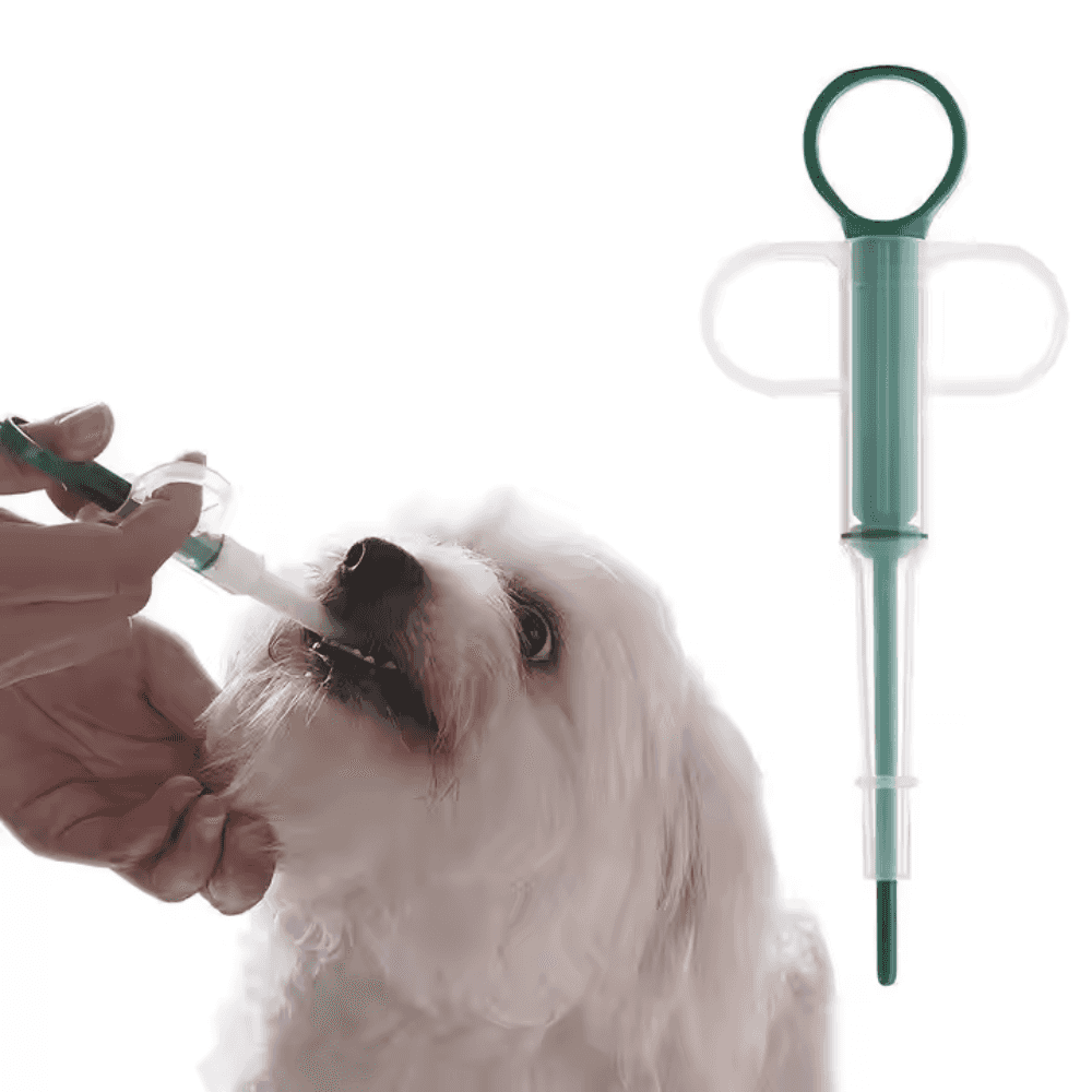Pet owner using Dogs Cats Feeding Medicine syringe with green tip to give oral medication to a small white dog.