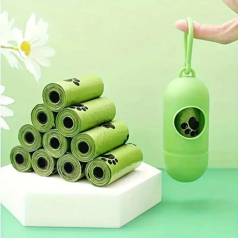 Bags Holder - Dog Poop Bag Holder shown with green dispenser and stacked rolls, attaches easily to leash for convenient dog walks.